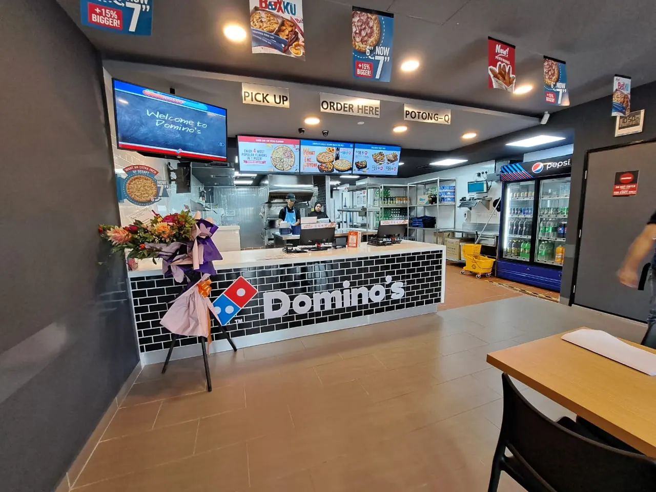 Completed Domino's service counter with menu boards