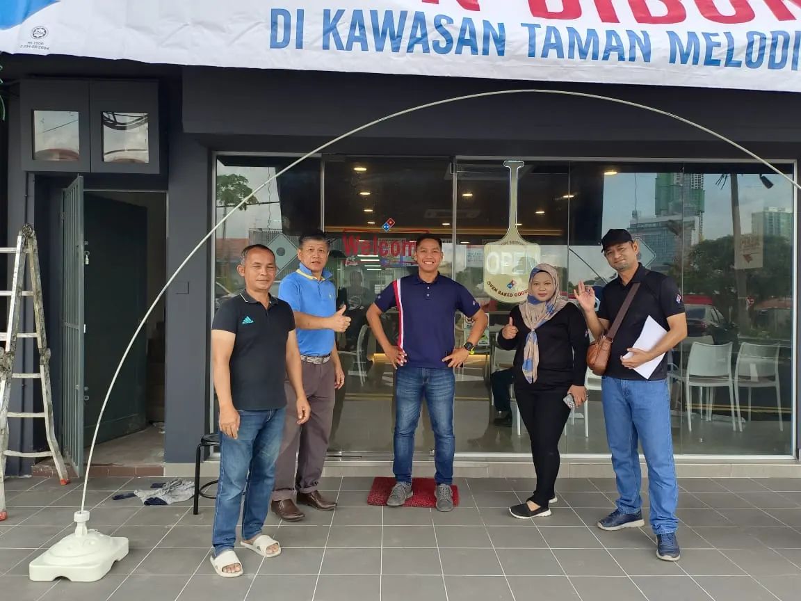 RA Services team with the client team at an outlet handover